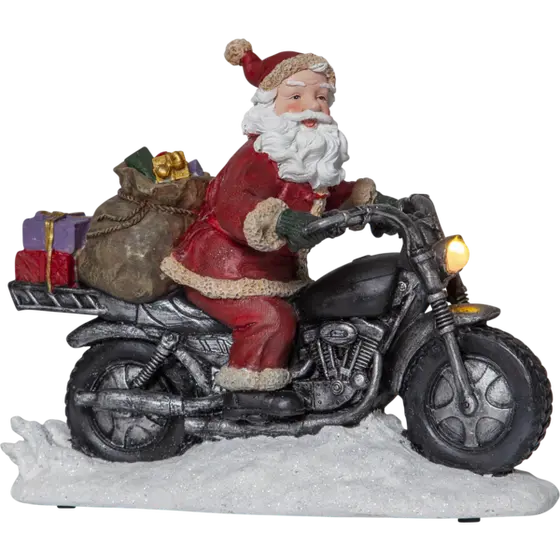 Tomte på motorcykel med lysande lampa (batteri)